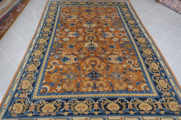 tappeto cinese da sala color salmone e blu