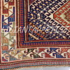 Tappeto caucasico Mogan di vecchia manifattura, lana su lana e annodato a mano con medaglioni geometrici tradizionali. Dimensioni 260x132 cm. Autentico tappeto caucasico decorativo.