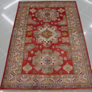 tappeto orientale kazak fondo rosso arancio da salotto