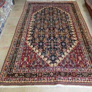 tappeto persiano gashgai kashkuli motivo herati fondo blu e rosso