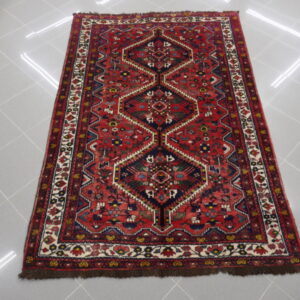 antico tappeto persiano gashgai da salotto fondo rosso