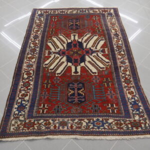 tappeto antico persiano gharajeh da salotto fondo rosso ruggine
