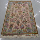 tappeto persiano tabriz extrafine 80 raj da salotto firmato con mazzi di fiori sul campo color pesca
