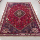 tappeto persiano gashgai fondo rosso da salotto