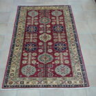 tappeto orientale kazak da salotto fondo rosso