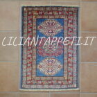 scendiletti kazak fondo azzurro geometrici circa 90x60 cm