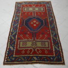 antico tappeto caucasico kazak fondo rosso molto primitivo