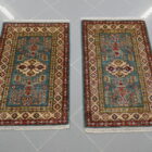 Scendiletti afghani orientali kazak fondo verde disegno geometrico